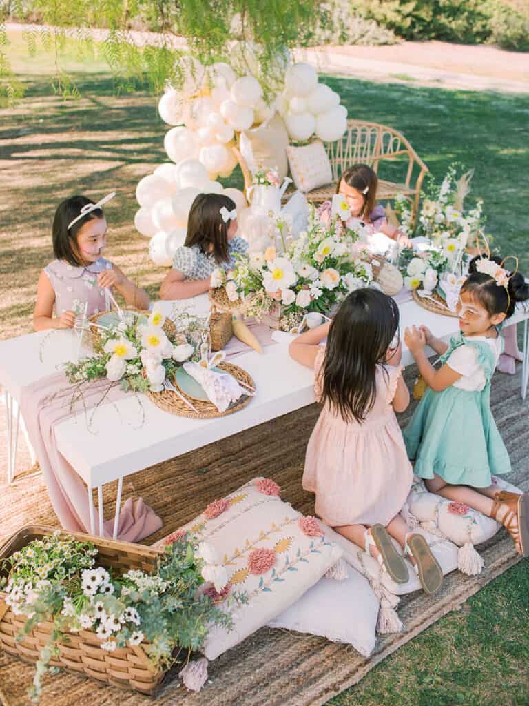 an image of small girls having an easter picnic