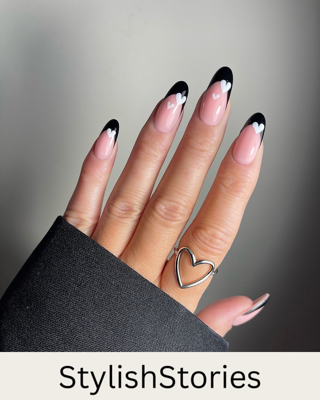 Stylish Black French Nails with White Heart Accents