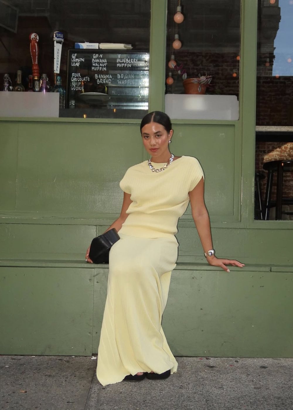 a woman wearing a butter yellow skirt and tee set