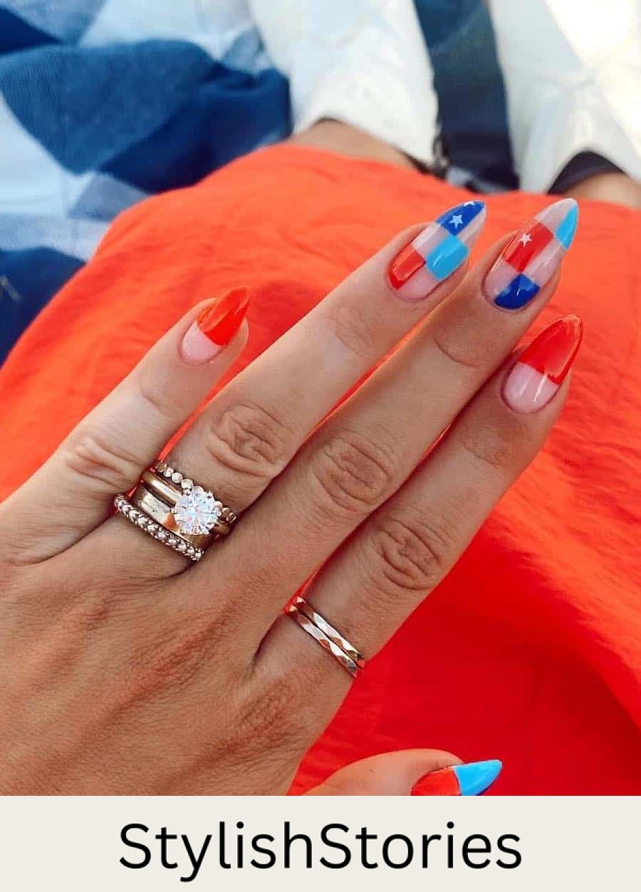 long nude almond nails featuring red, light blue, and dark blue checkerboard art with star accents