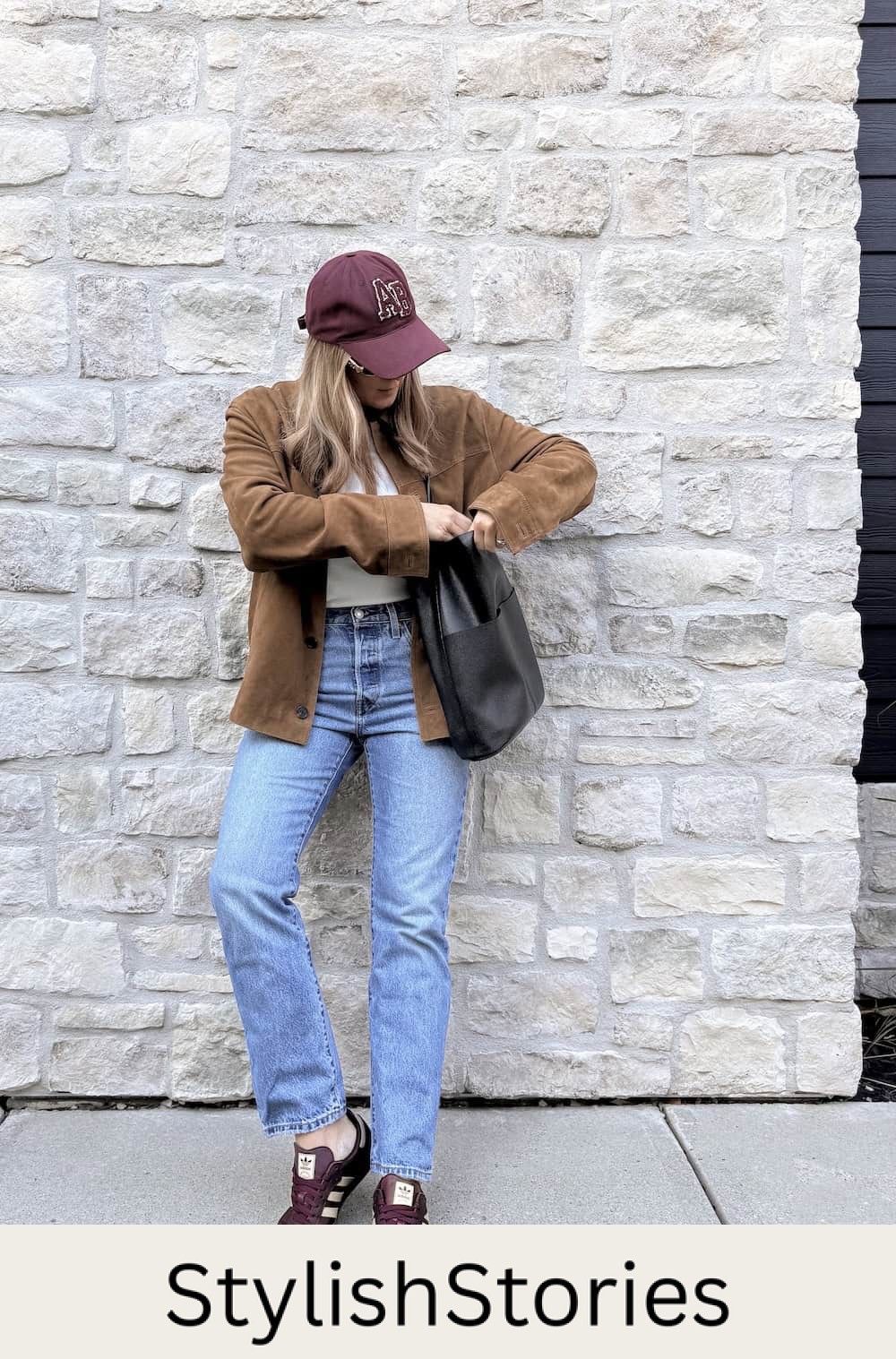 Christal wearing jeans, a white tee, a suede jacket and sambas.