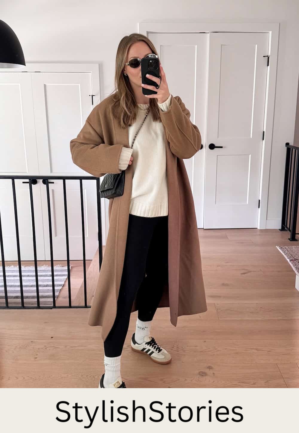 Christal wearing leggings with a white sweater and a camel colored cardigan with sambas.