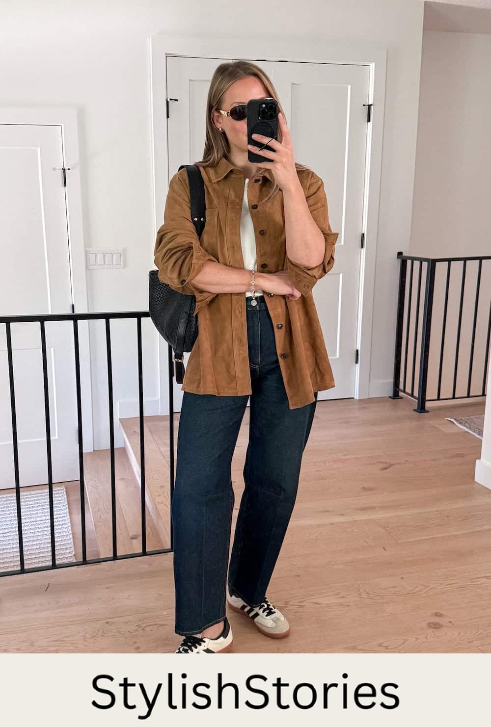 Christal wearing jeans with a white tee and a suede shacket with sambas.