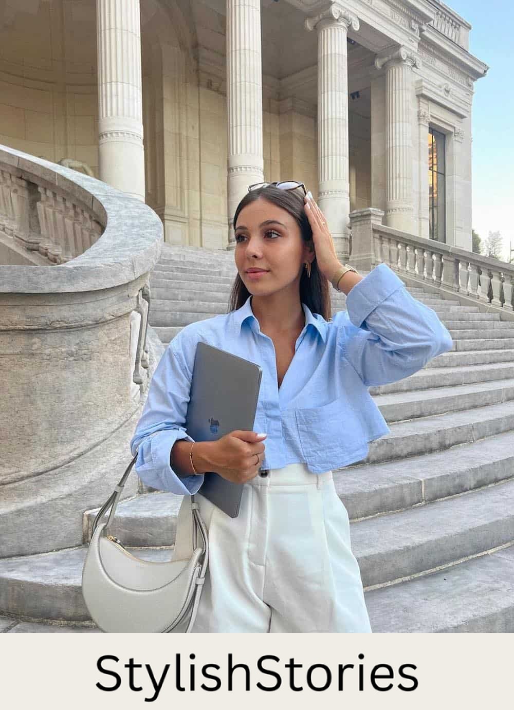 Woman wearing tailored white shorts with a cropped linen button down.