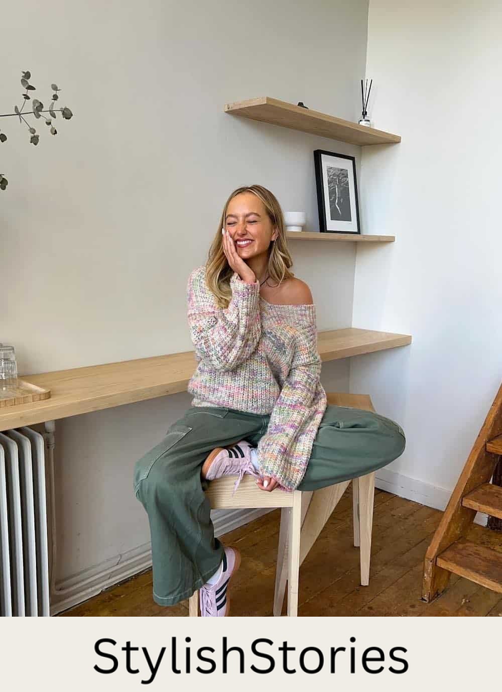 Woman wearing baggy cargo pants with a colorful sweater and sneakers.