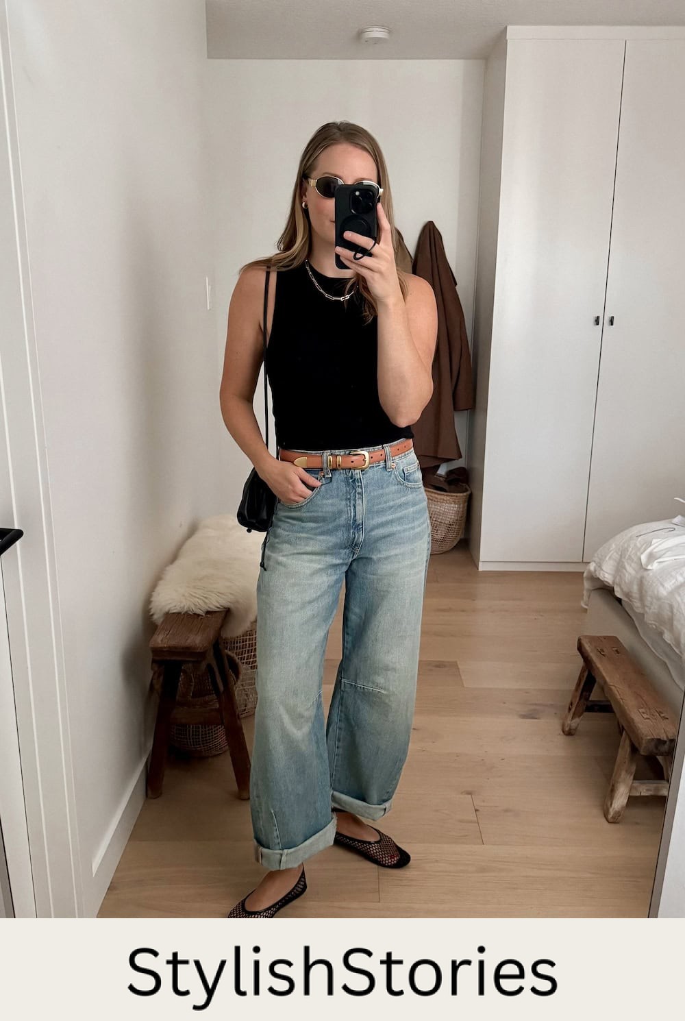 Christal wearing jeans, mesh ballet flats and a black tank top.