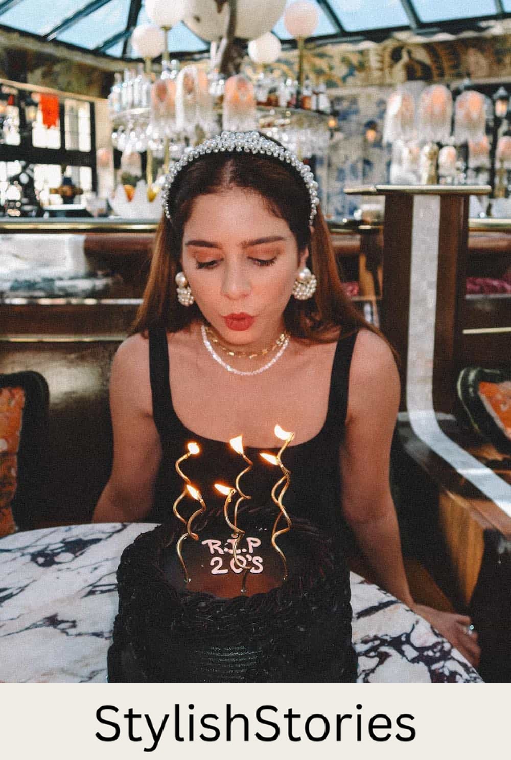 woman blowing out the candles of a cake with 