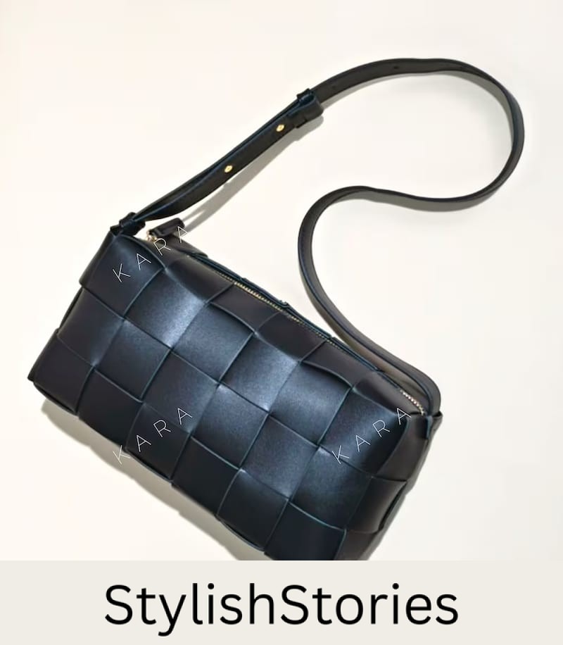 image of a black woven shoulder bag that is a dupe of the Bottega Veneta cassette bag