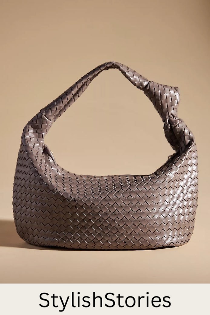 a woven hobo satchel bag in taupe that's a dupe of the Bottega Veneta Maxi Jodie bag