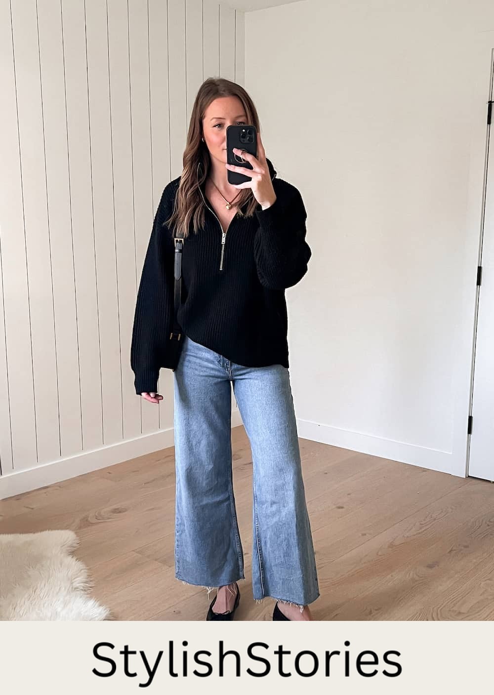 Christal wearing an outfit with a black half-zip sweater and wide-leg jeans from Mango with black ballet flats as an idea for a capsule wardrobe outfit