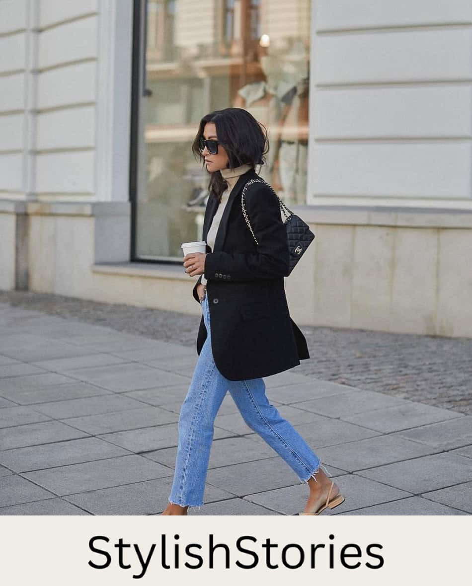 Woman wearing a black blazer with blue jeans and beige Chanel slingback flats