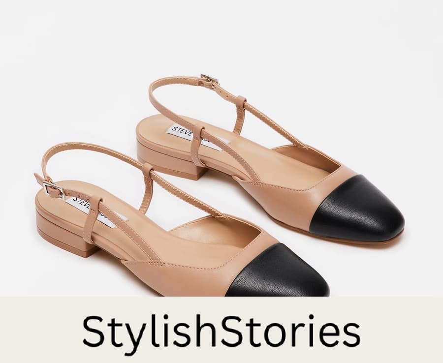 image of a pair of beige slingback low heels with a black cap toe
