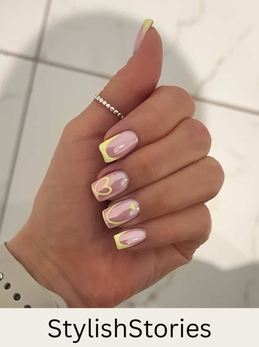 nude nails with yellow tips and accent art with chrome finish