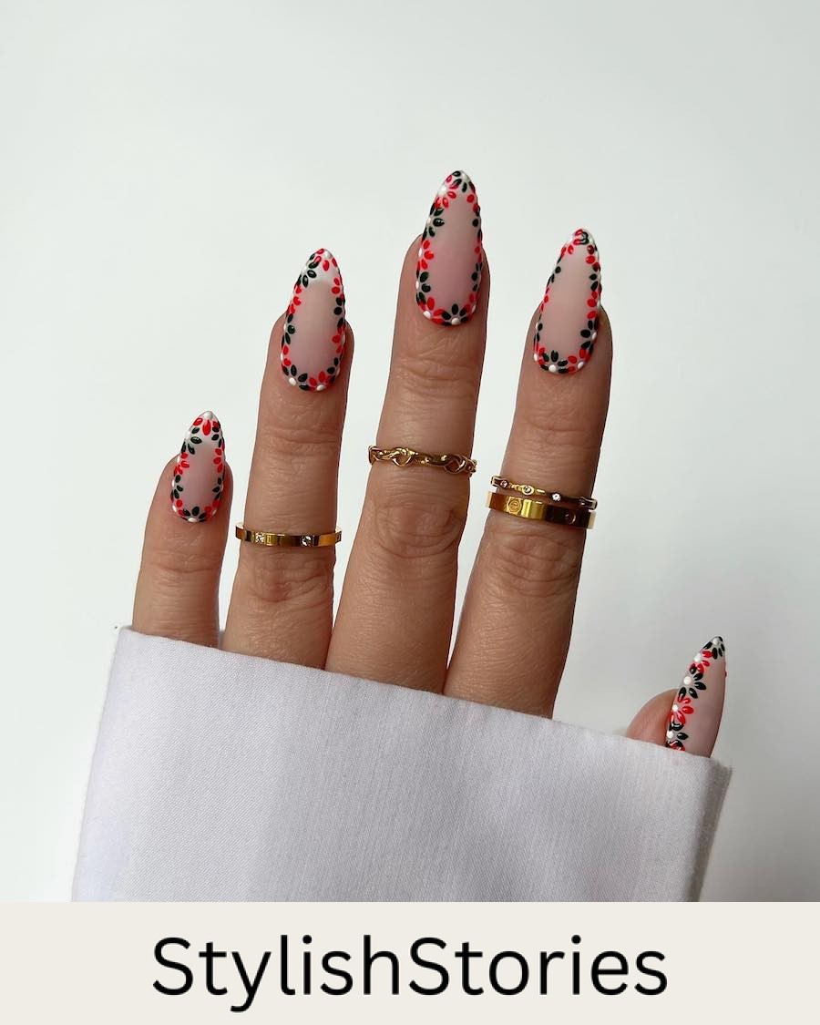 A hand with long nude almond nails with green, red, and white holiday wreath borders