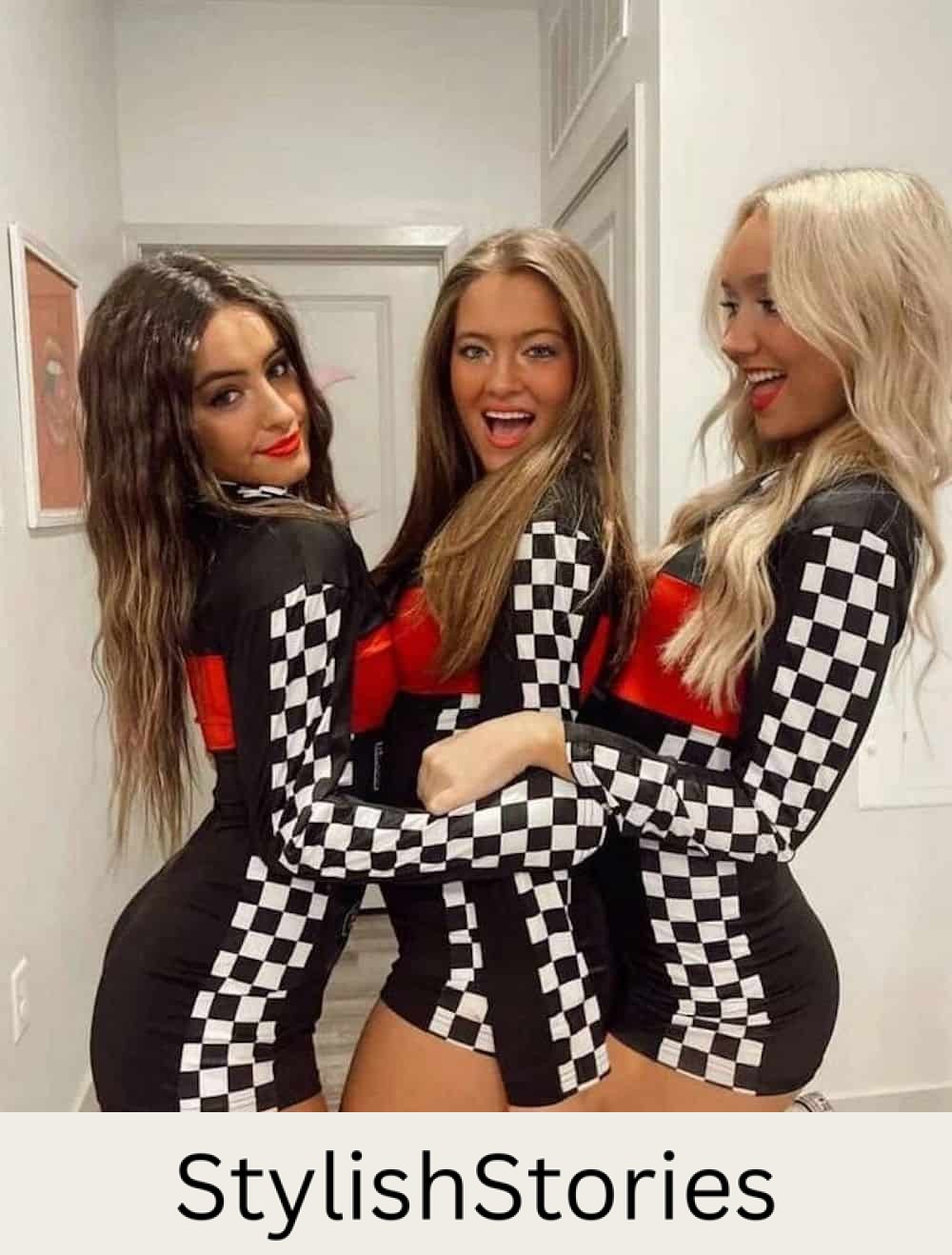 Three women dressed up as race car pit crew on Halloween.