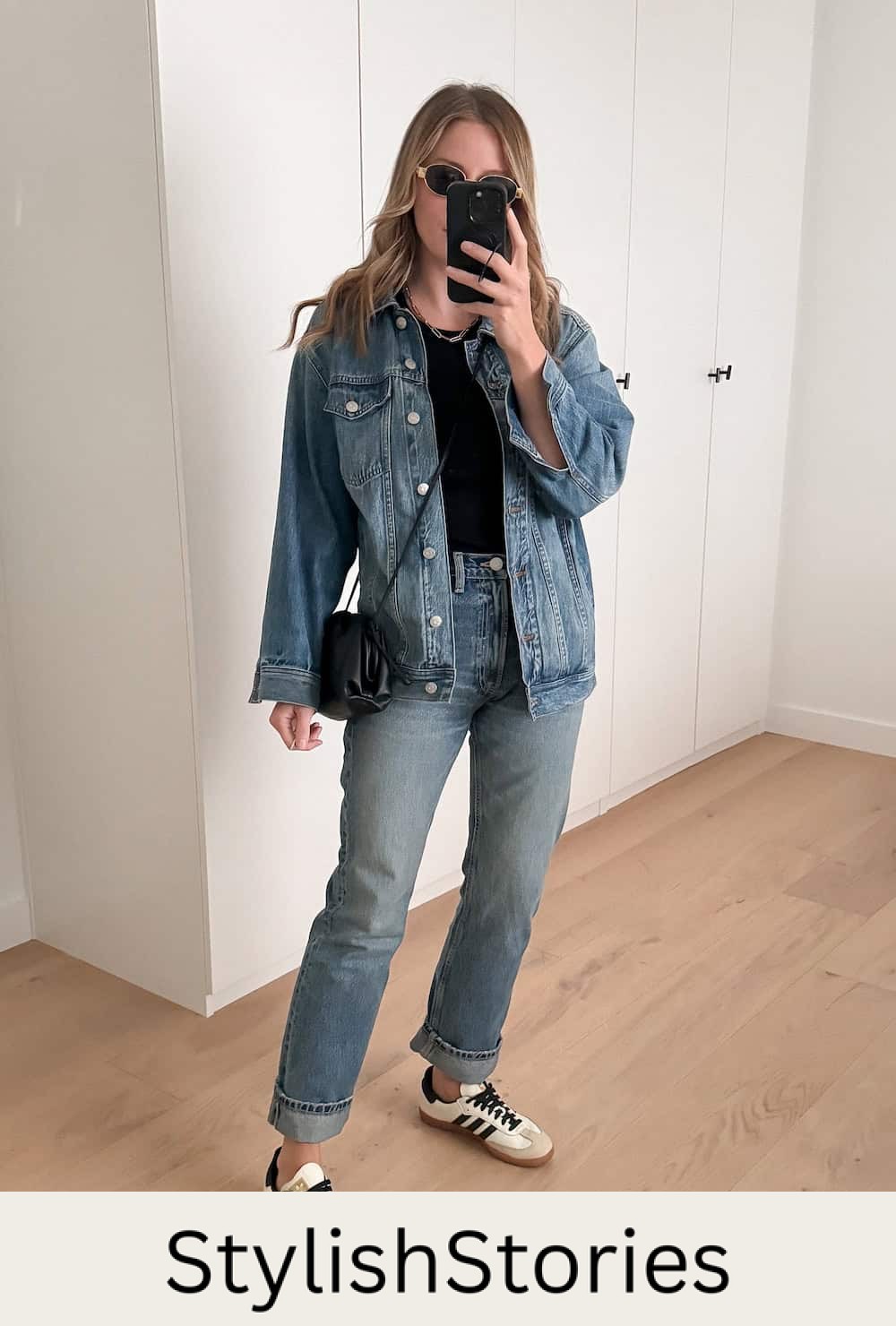 Christal wearing jeans with a matching denim jacket and a black t-shirt with sneakers.