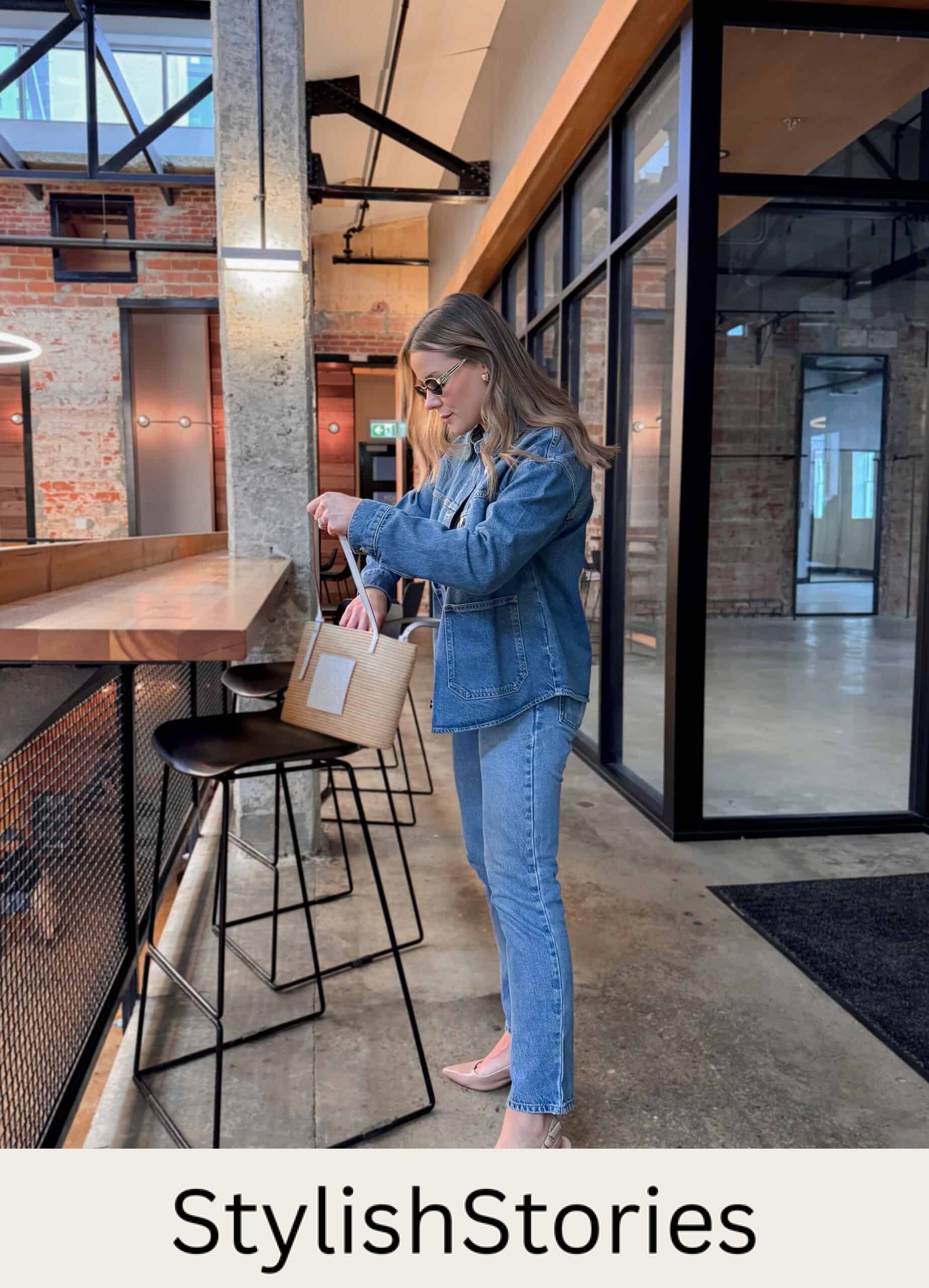 Christal wearing jeans, a denim shirt jacket and nude kitten heels.