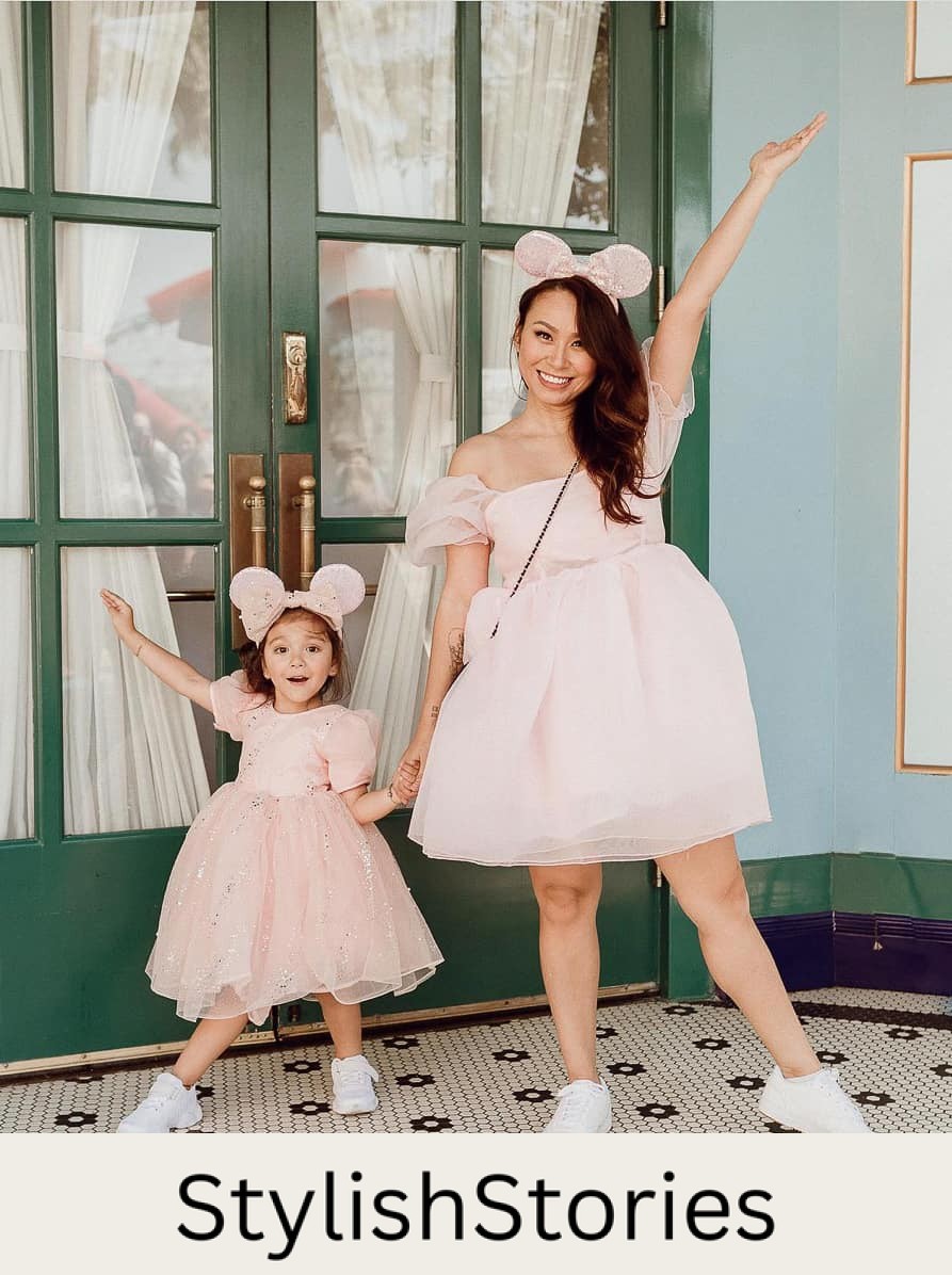 woman in a pink organza dress with her small daughter in a matching dress