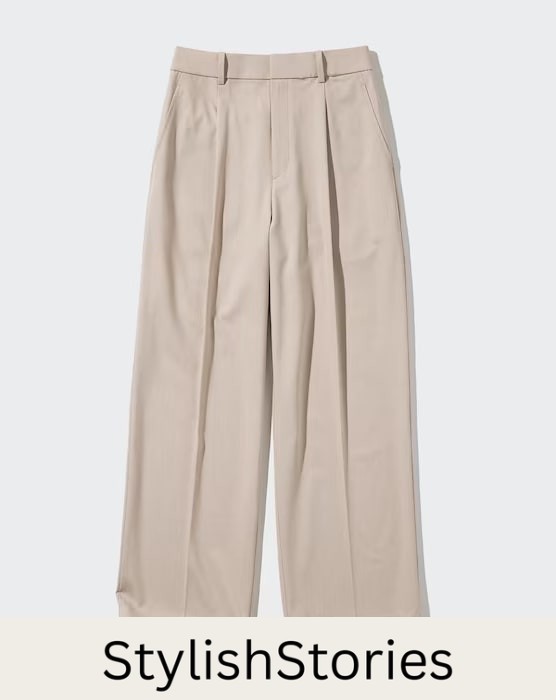 Image of a pair of light beige wide-leg pleated trousers