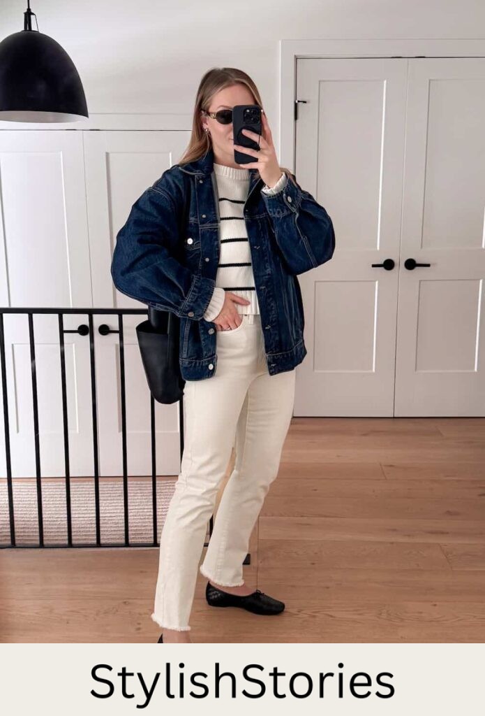 Christal wearing white jeans, a black and white seater and black flats with a denim jacket.