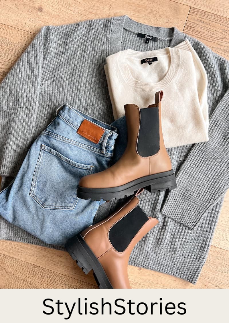 image of a fall capsule wardrobe outfit flat lay with a grey knit cardigan, ivory cashmere t-shirt, blue jeans, and brown lug boots 