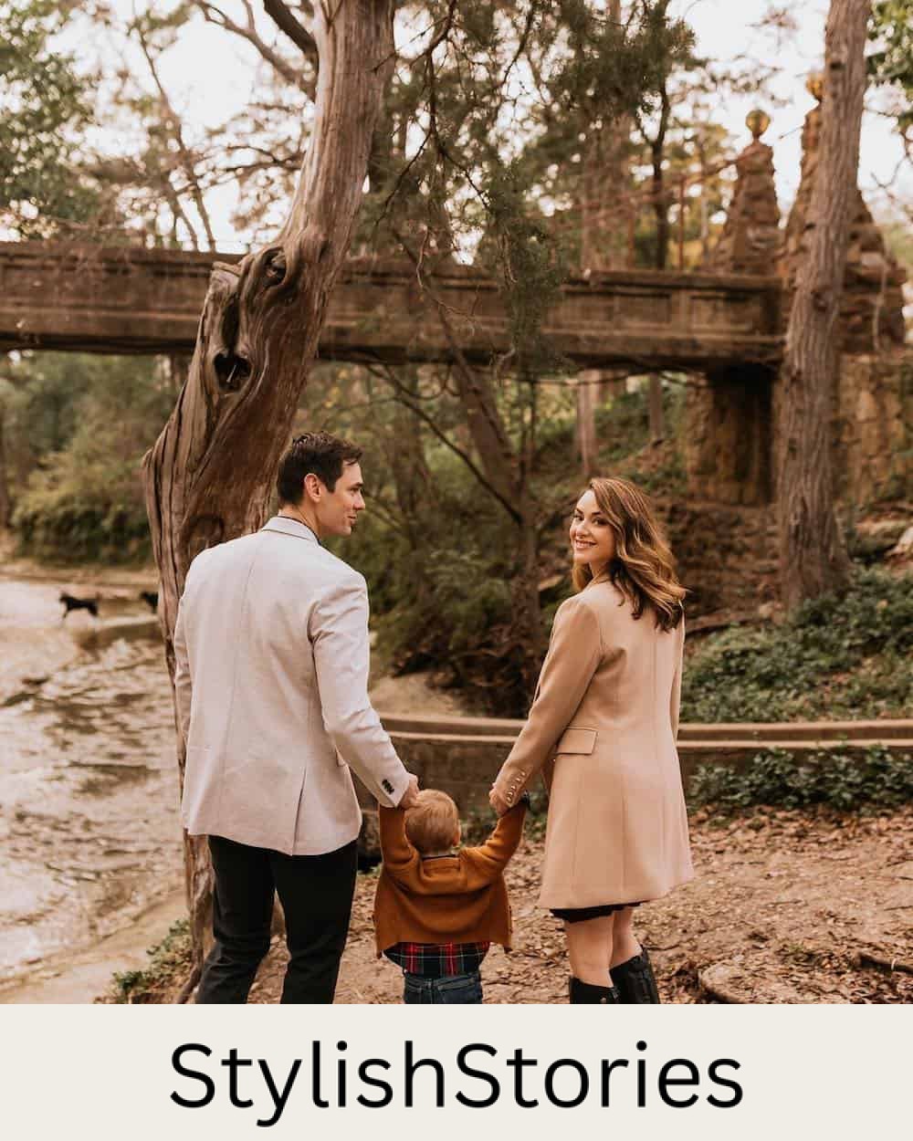 image of a family having an outdoor fall photoshoot with a mom, dad, and small boy, all wearing neutral colors