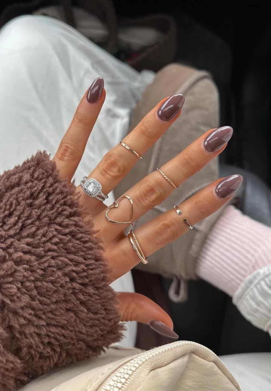 medium round mocha-colored nails with a chrome finish