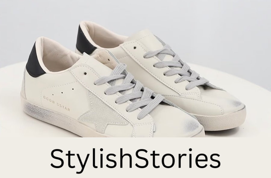 image of a pair of white sneakers with a star detail on the side and distressing