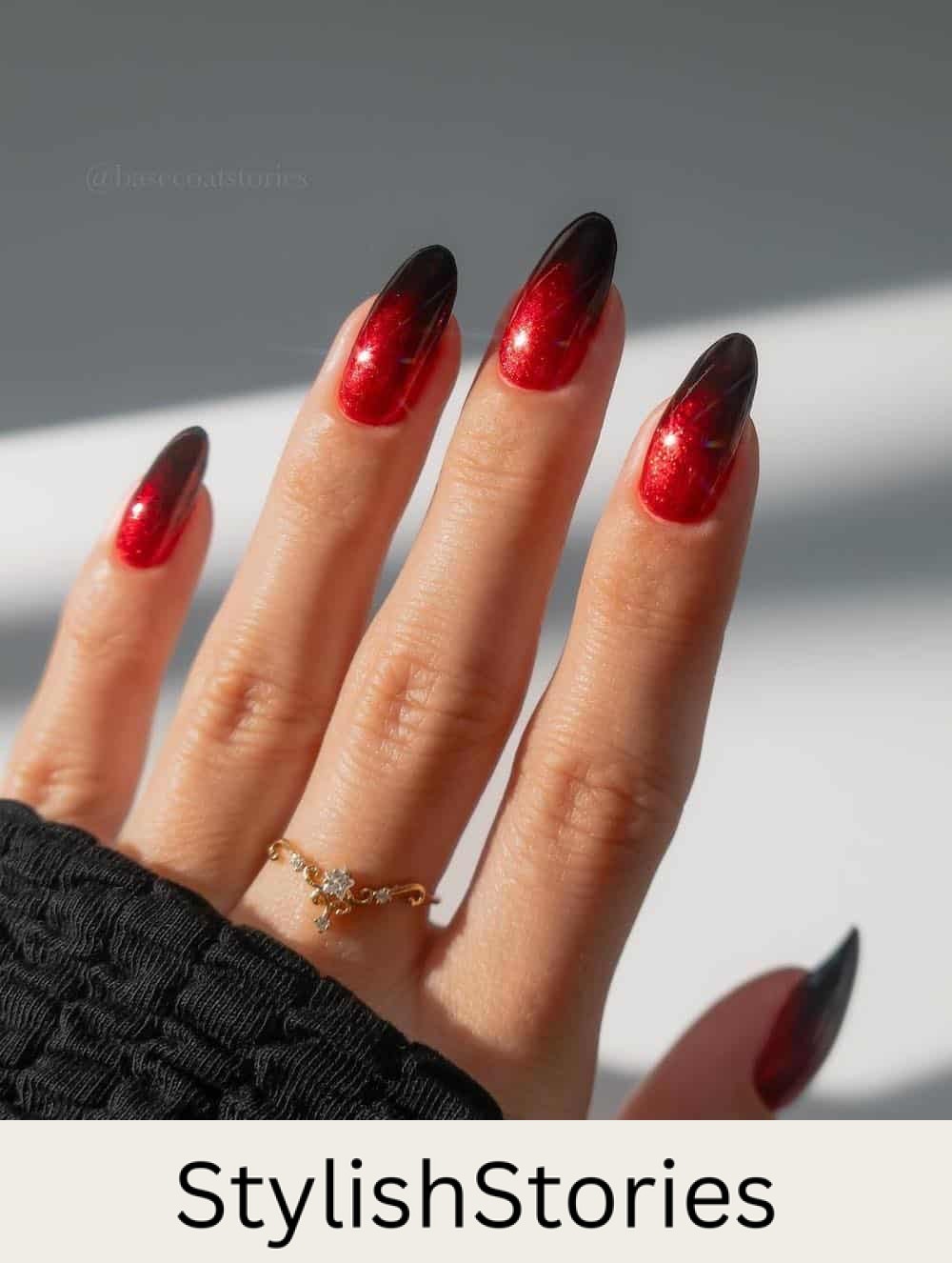 medium almond nails with a sparkly red and black ombre