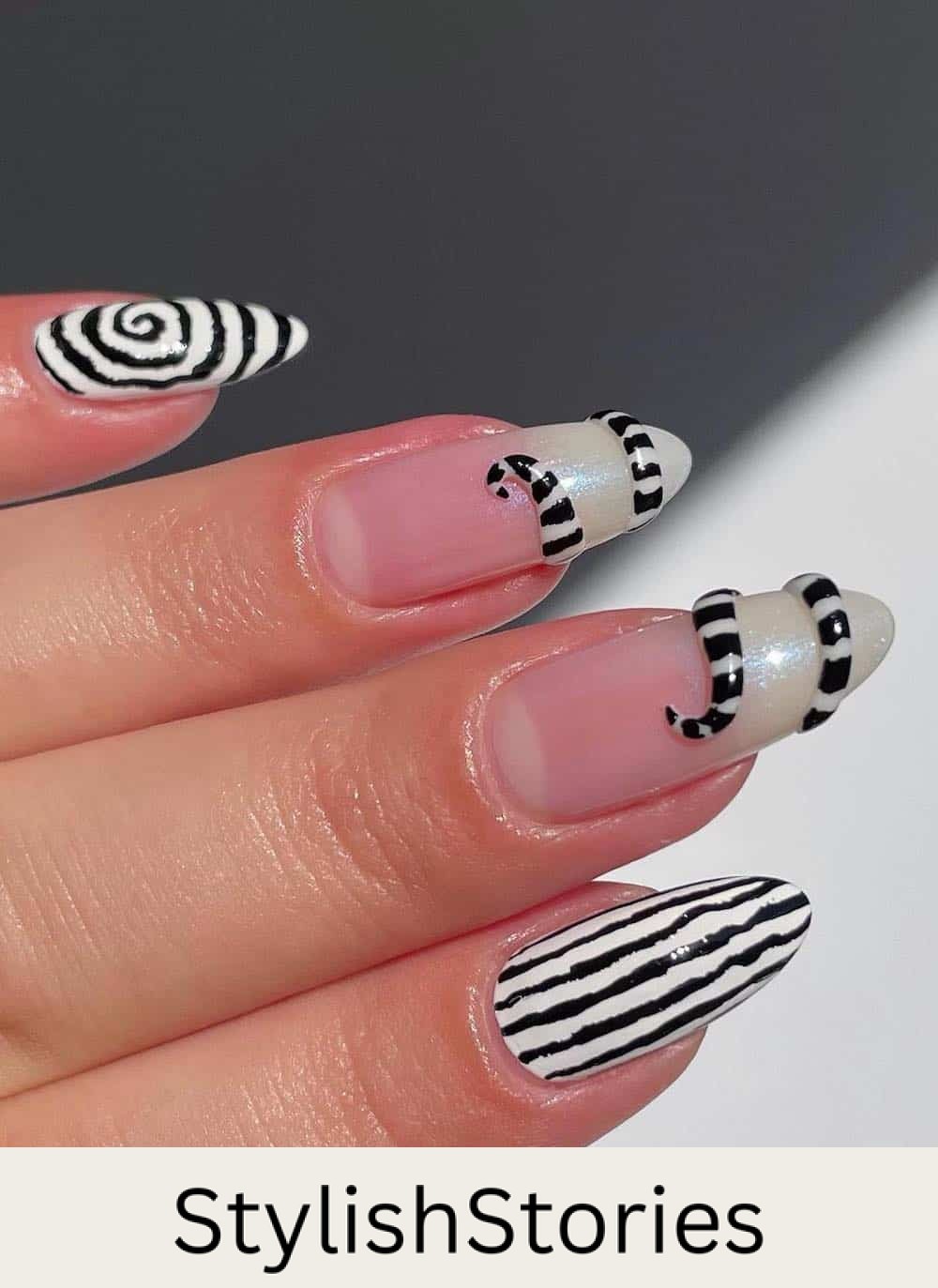 long almond nails with white and black striped nail art