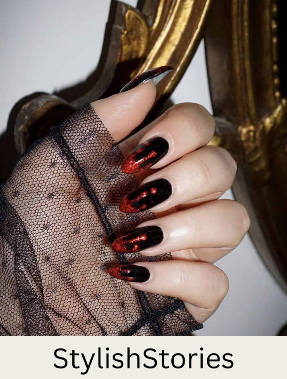 long black almond nails with glittering red dripping tips