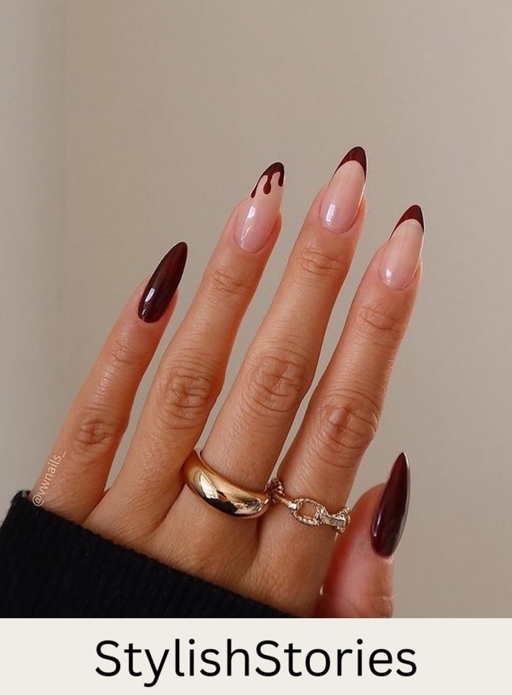 long nude almond nails with dark red tips, solid accent nails, and a dripping tip accent nail