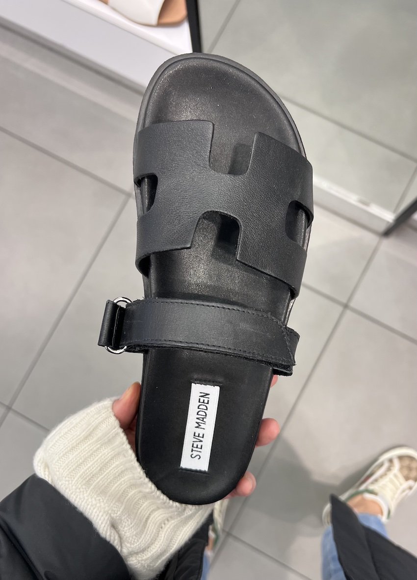 image of a black sandal that is a dupe of the Hermes Chypre sandal