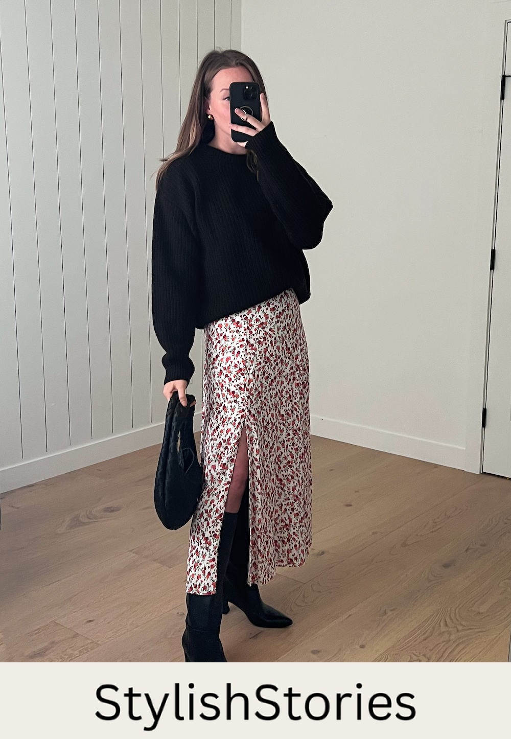 Christal wearing a floral dress with black boots and a black sweater.