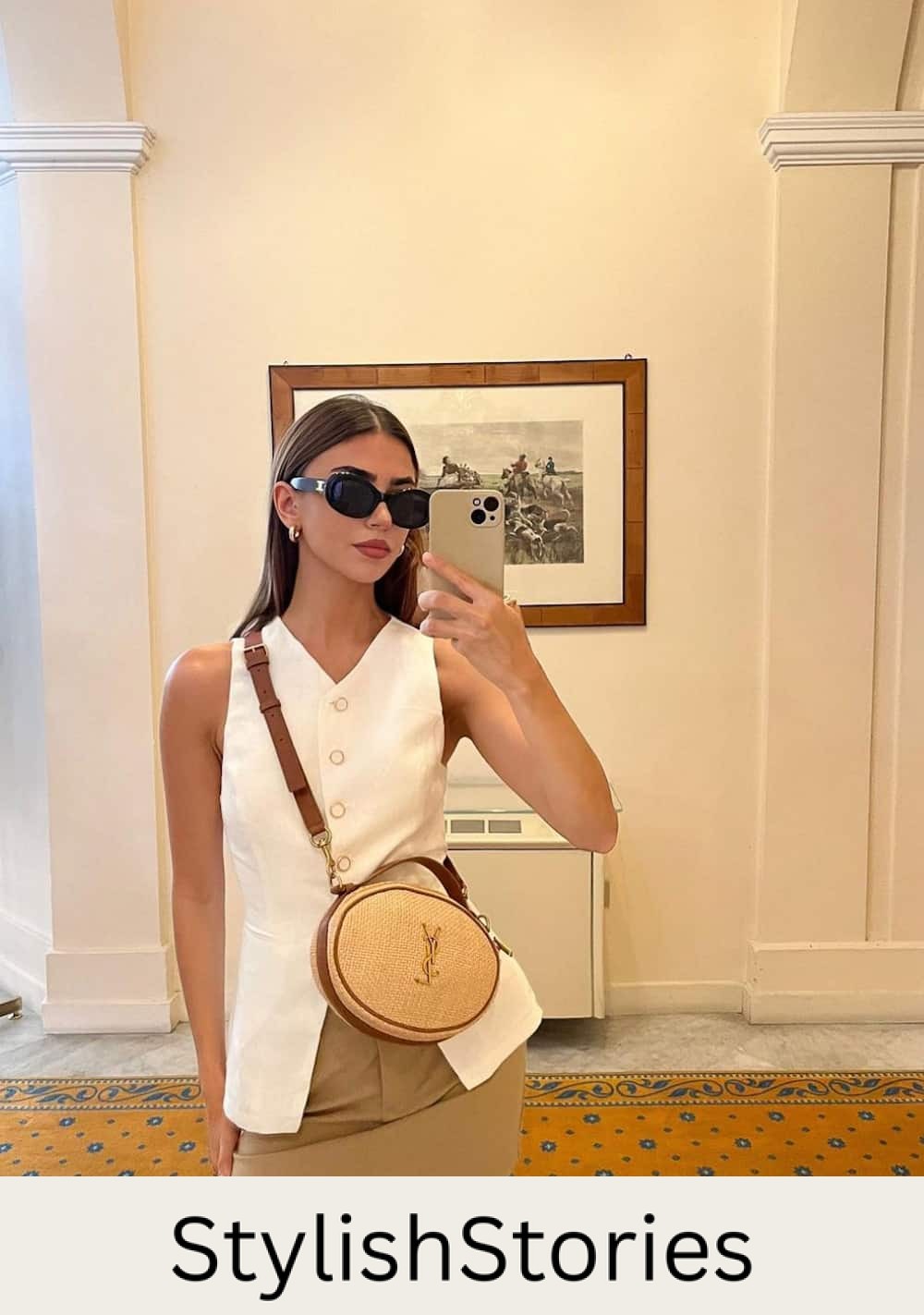 Woman wearing a tan skirt with a white vest top.