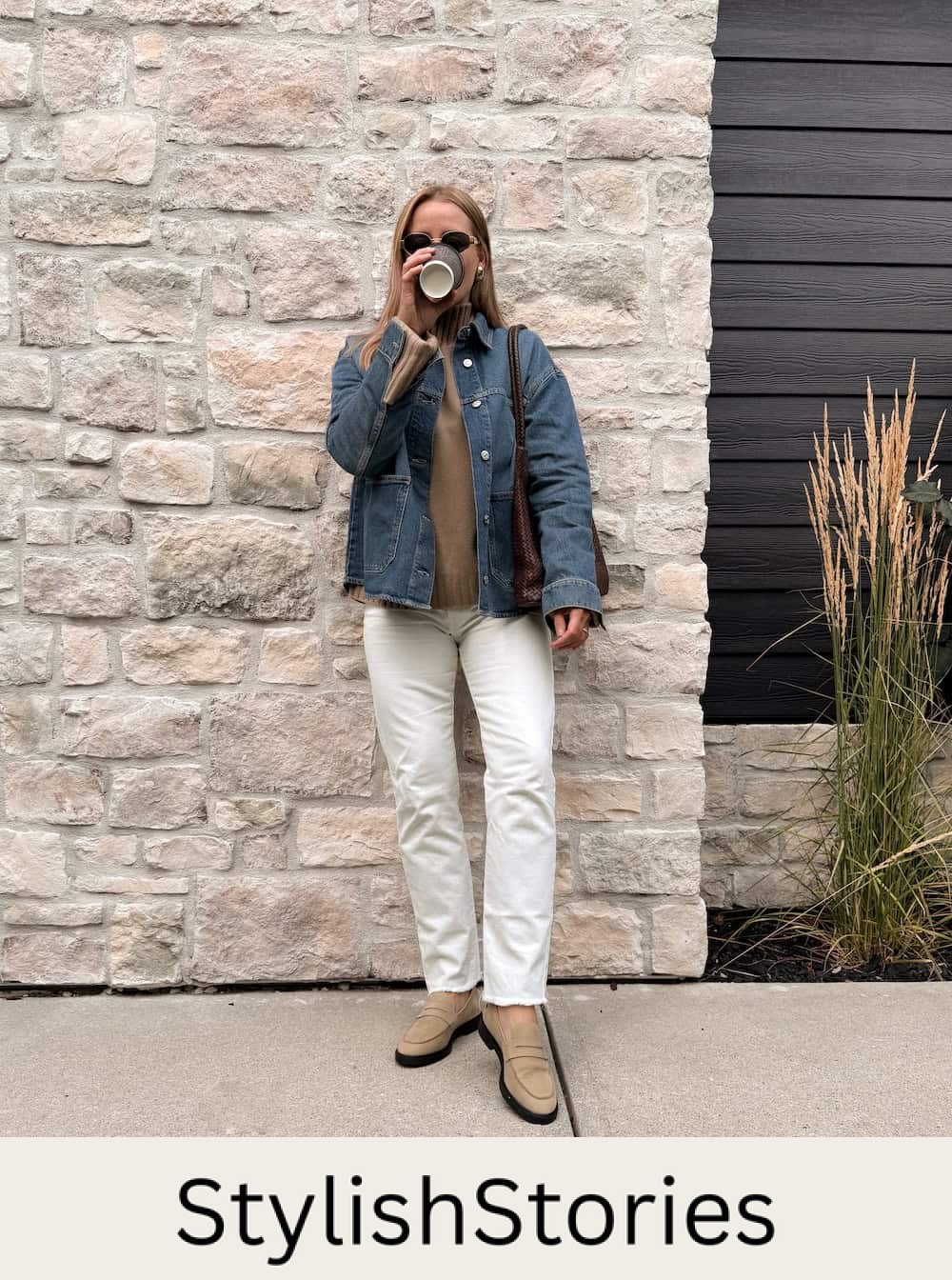 Christal wearing white jeans with a denim jacket and loafers.