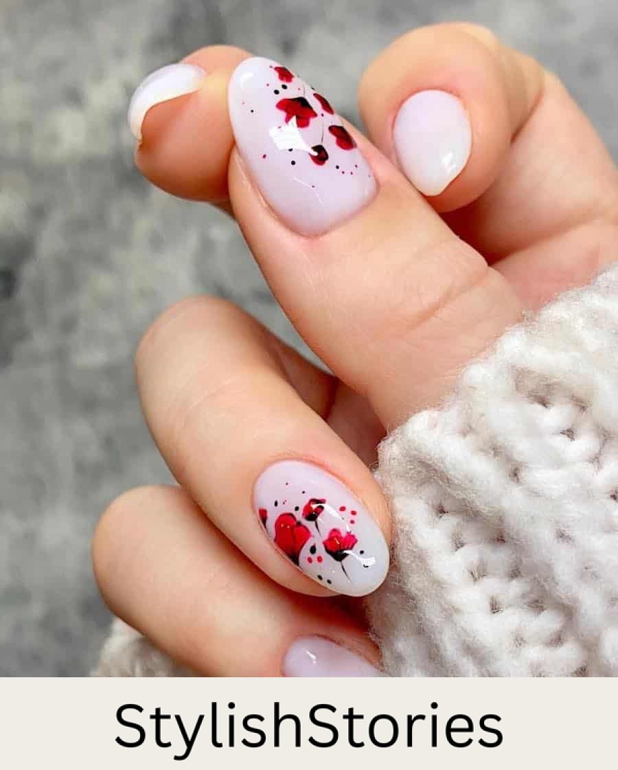 medium milky white almond nails with red poppy nail art