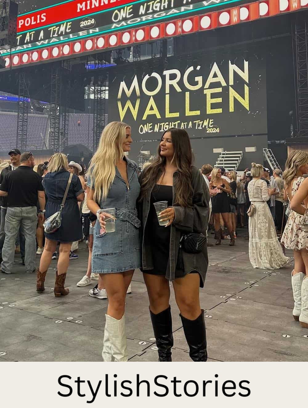 two women standing in front of a Morgan Wallen concert sign wearing cute outfits
