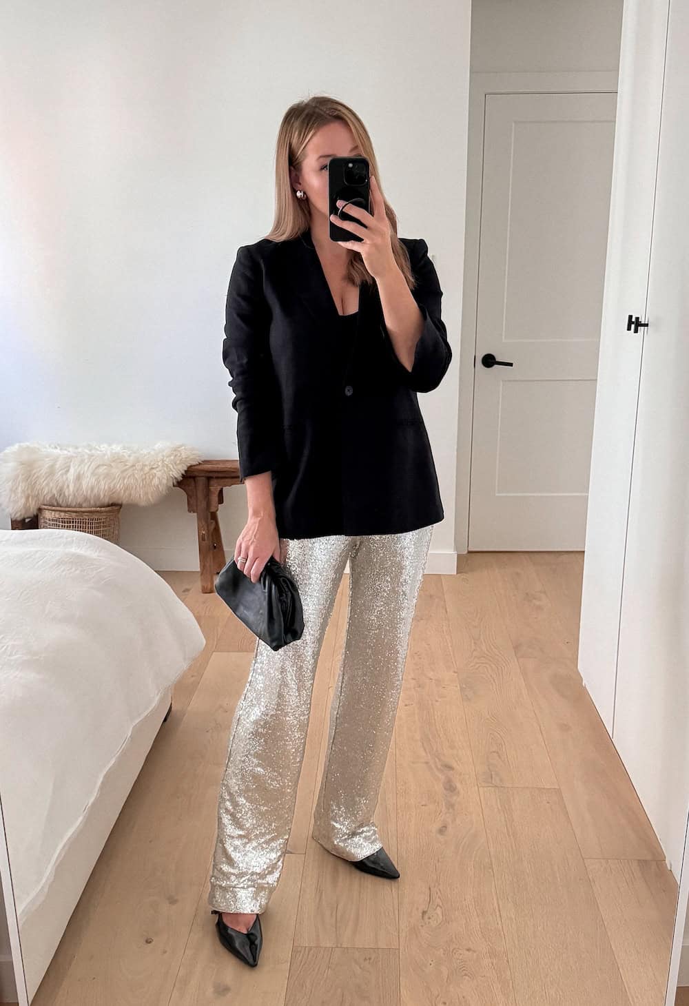 Christal wearing sequin pants with a velvet blazer and pumps