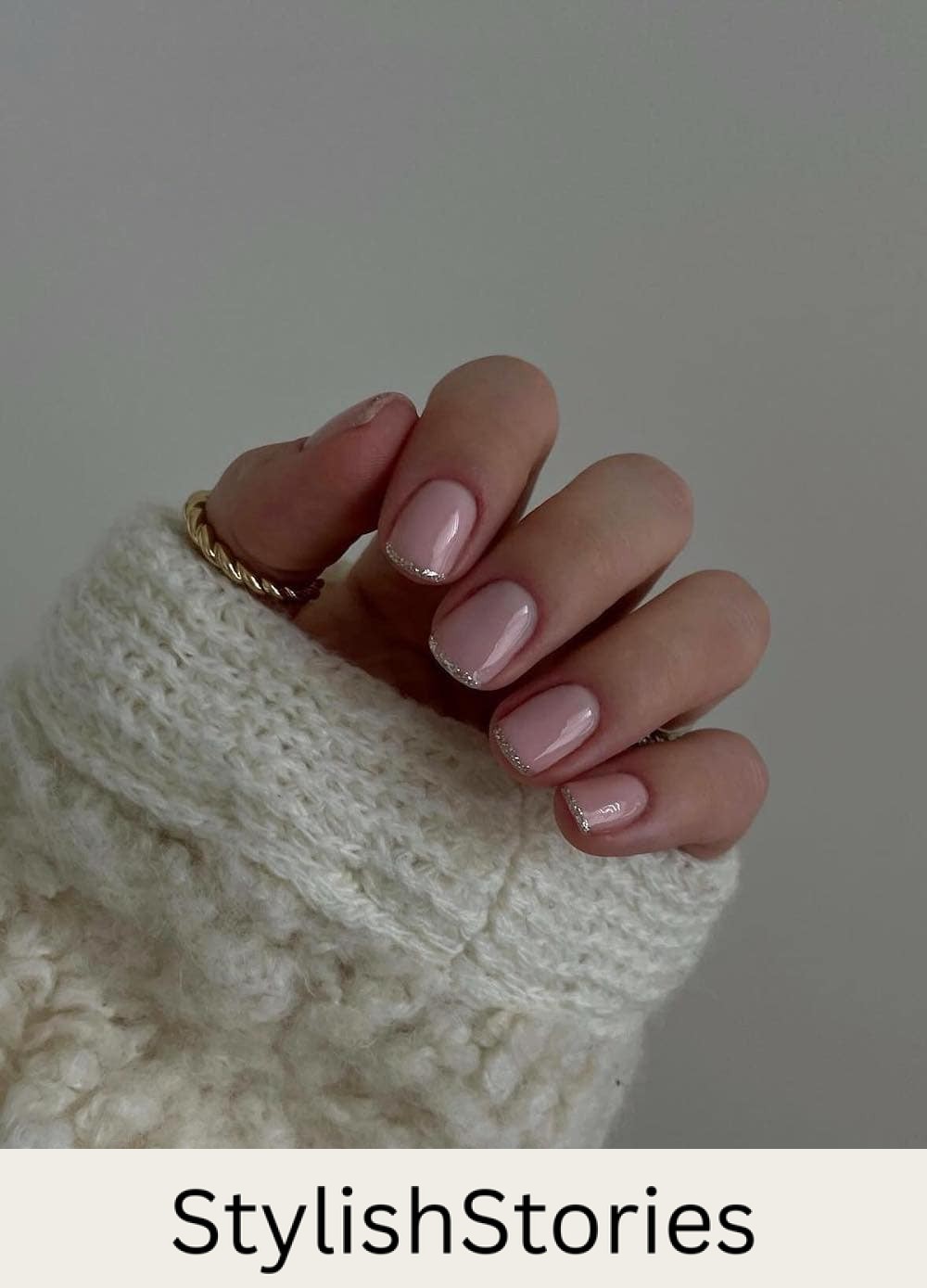 short nude pink nails with silver glitter tips