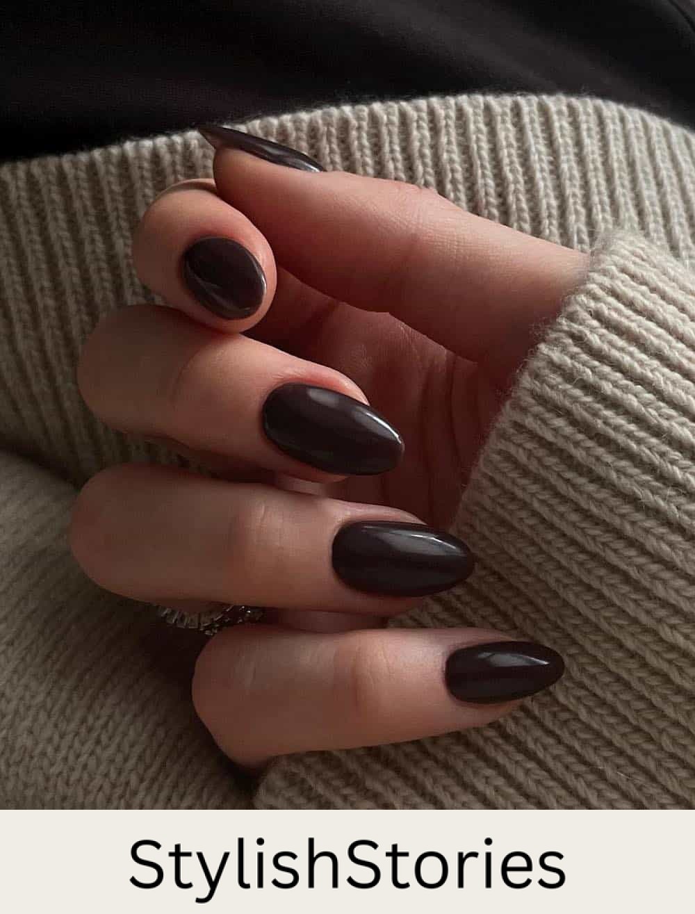 medium almond nails with dark brown polish