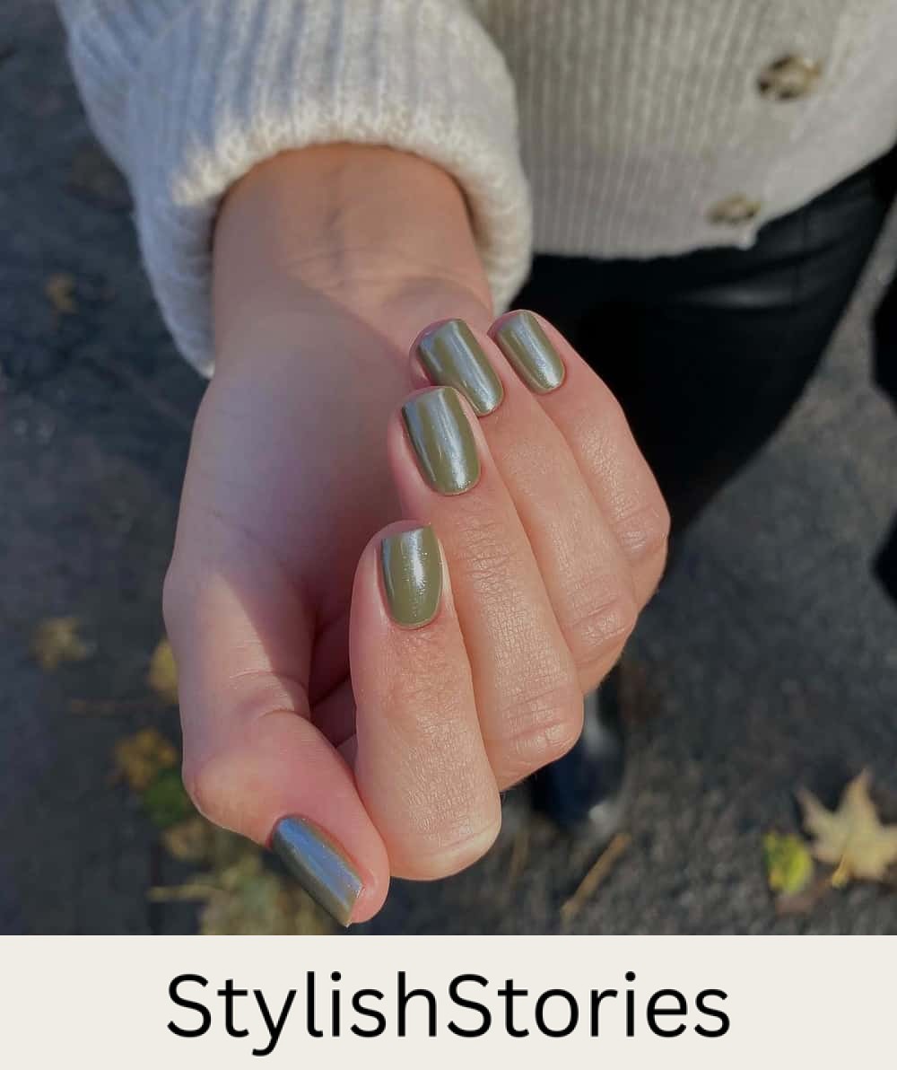 hand with short olive green nails