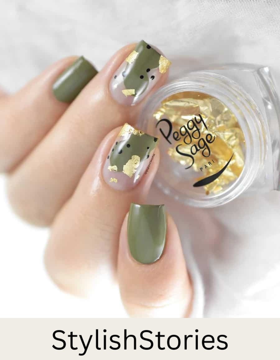 hand with short nails with olive green polish and gold foil accents