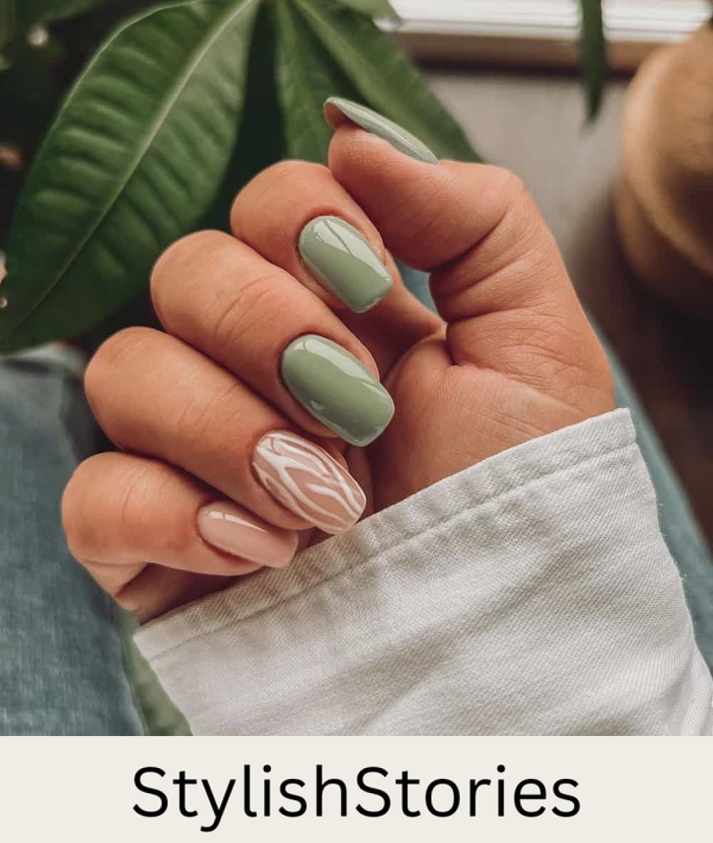 hand with short square nails with light olive and neutral colors
