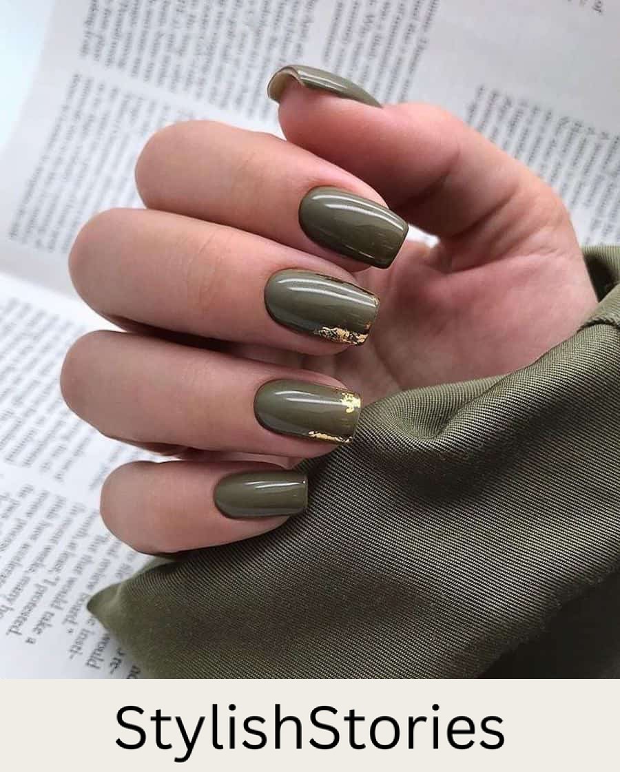 hand with short coffin nails in olive green and gold foil accents