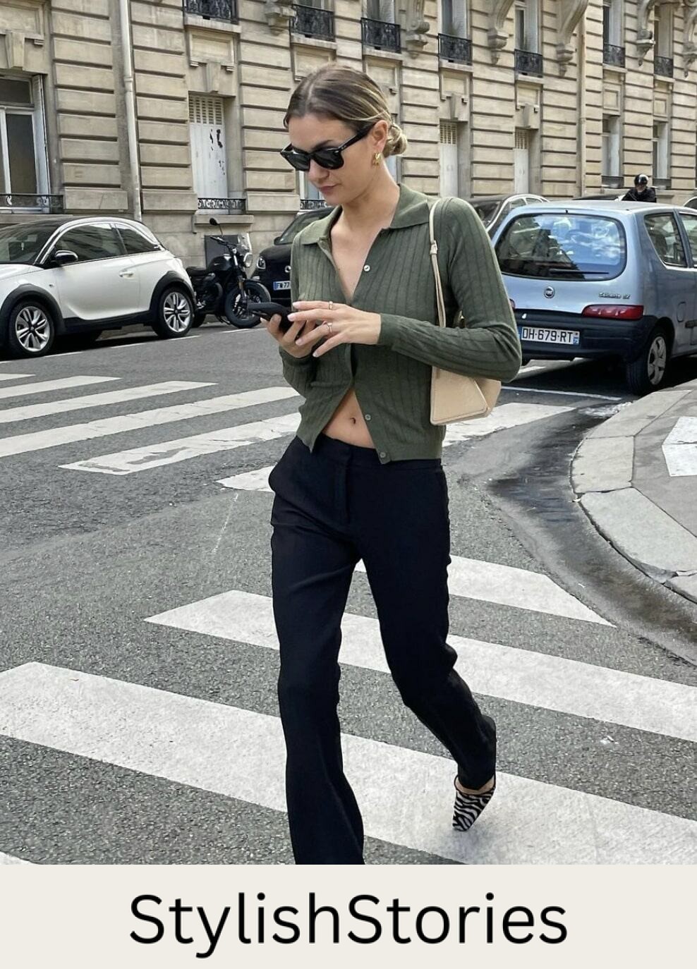 french woman wearing a green cropped cardigan with black flared pants and heels