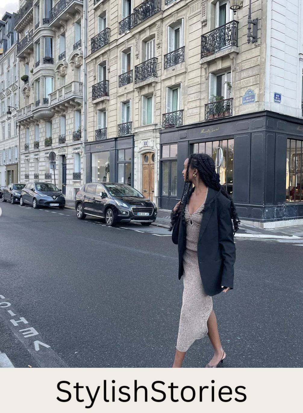 French woman wearing an oversized blazer with a dress and kitten heels in Paris