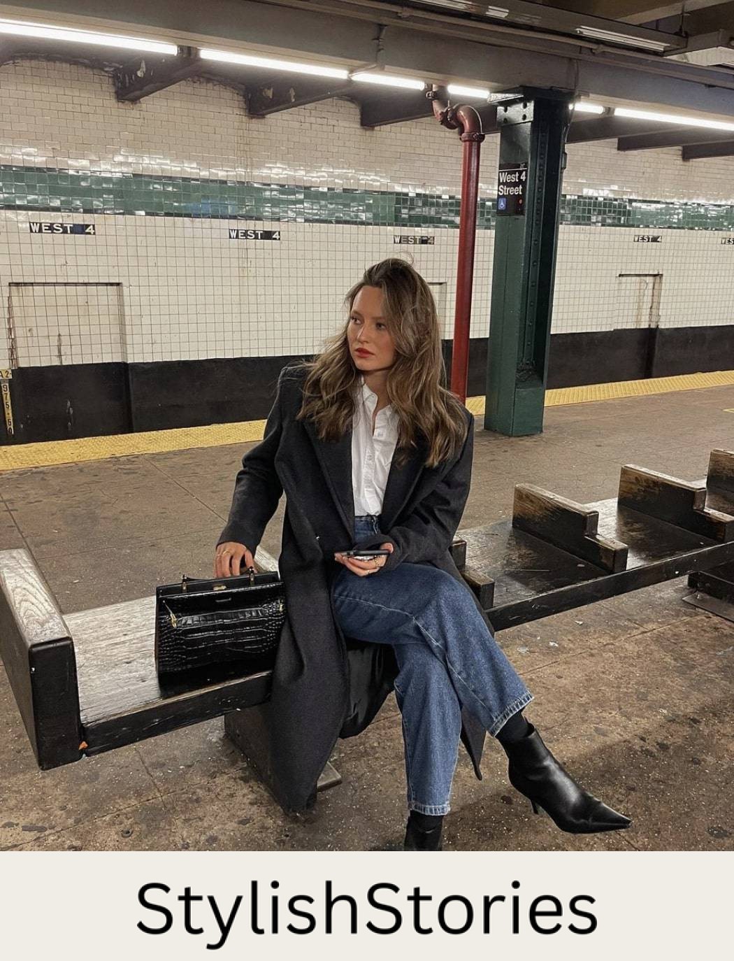woman wearing a long black coat with blue jeans and pointed black boots