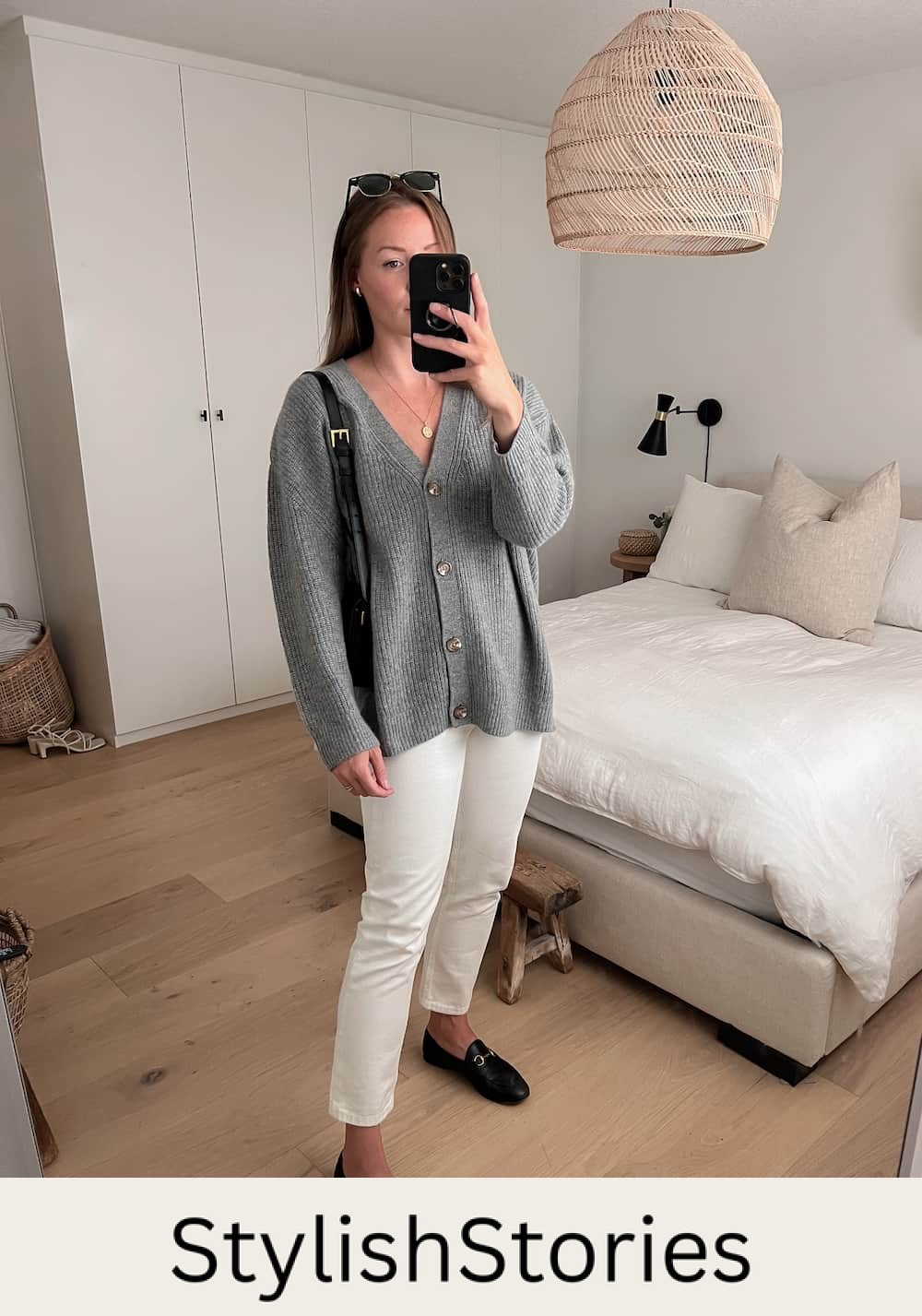 Christal wearing an oversized grey Quince cardigan with white jeans and black loafers as part of a fall capsule wardrobe 
