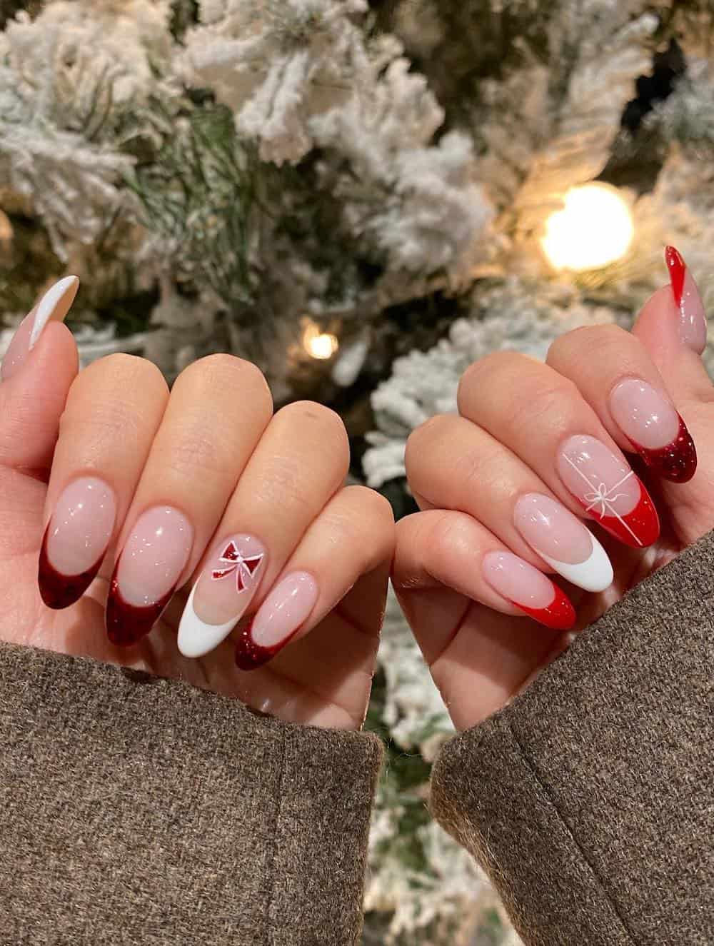 Red and Burgundy french tip manicure with white present bow details.